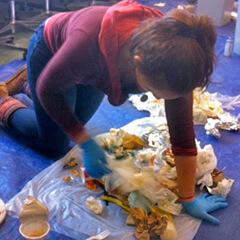 Greening of Aiken student intern sorts through Aiken trash.