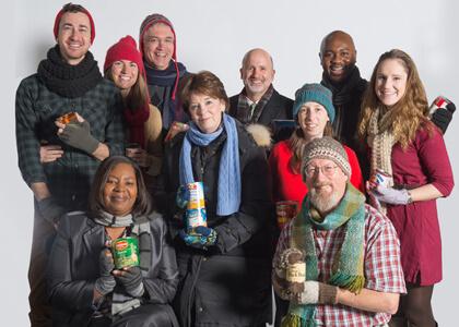 UVM staff with hats, scarves, mittens, food donations
