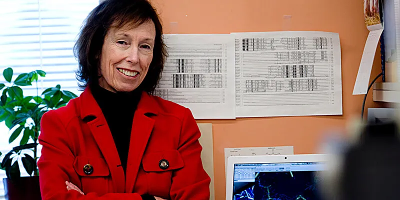 Dr. Susan Wallace in front of her computer