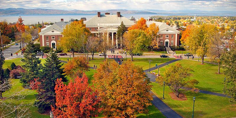 view of Waterman building, fall trees and Lake Champlain in the distance