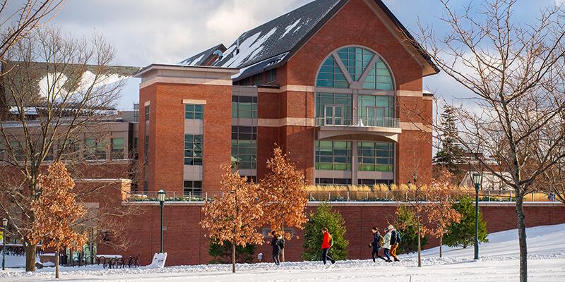 UVM in winter with snow covered Davis Center green