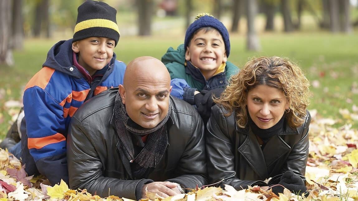 family in fallen leaves