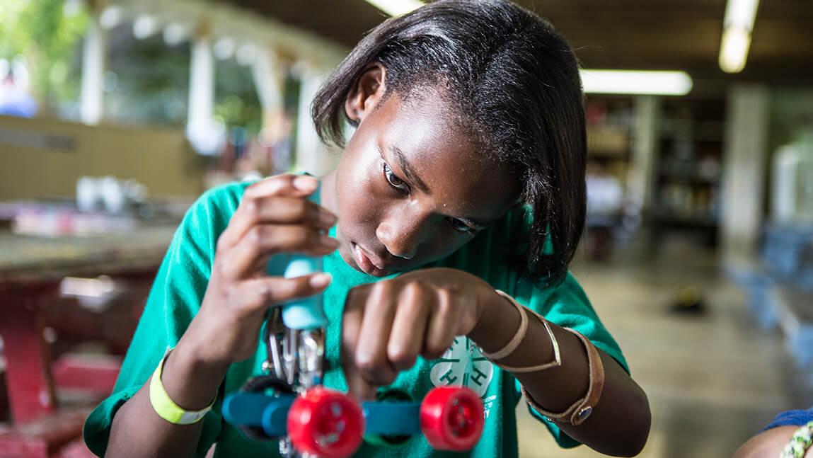 girl building robot