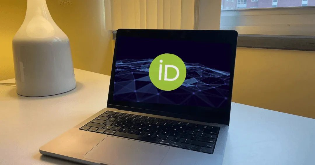 Laptop with ORCID graphic on the screen.