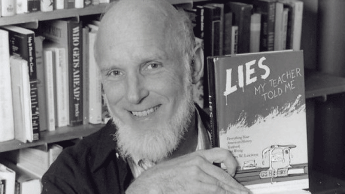 James Loewen holding his book, "Lies My Teacher Told Me"