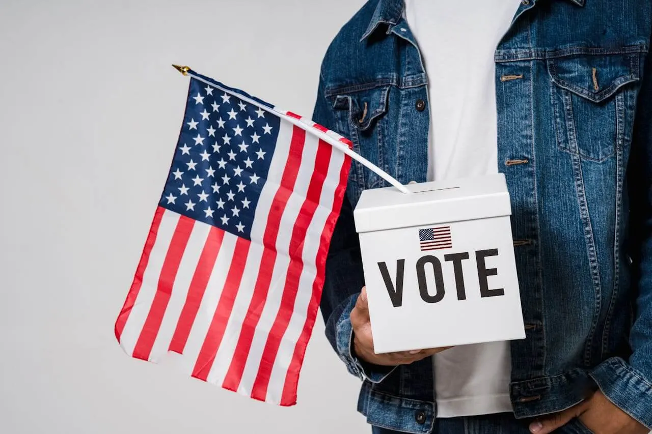 An image of an American flag and a voting box. UVM scholars are available to comment on the 2024 U.S. election. Photo: Sora Shimazaki/Pexels.