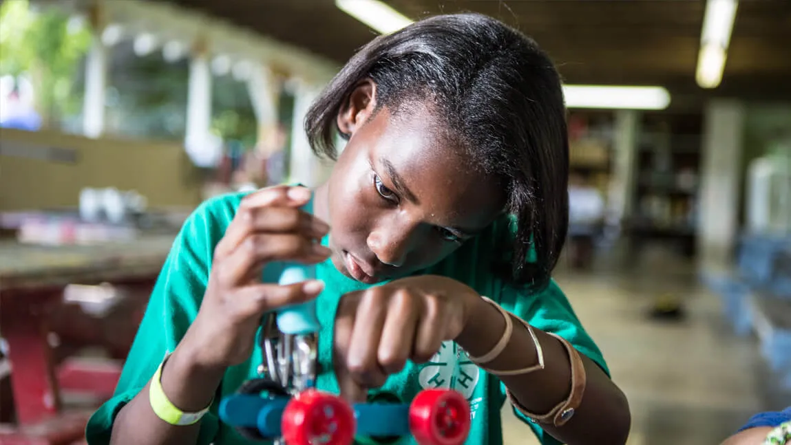 young girl inventing something cool