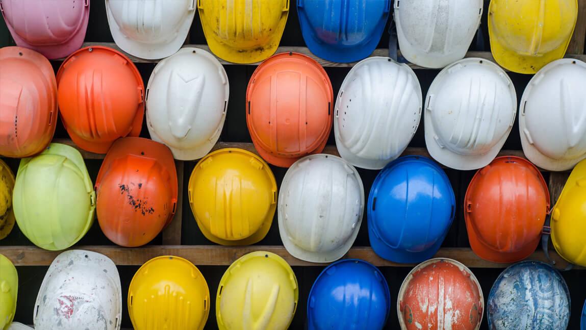 a bunch of safety helmets