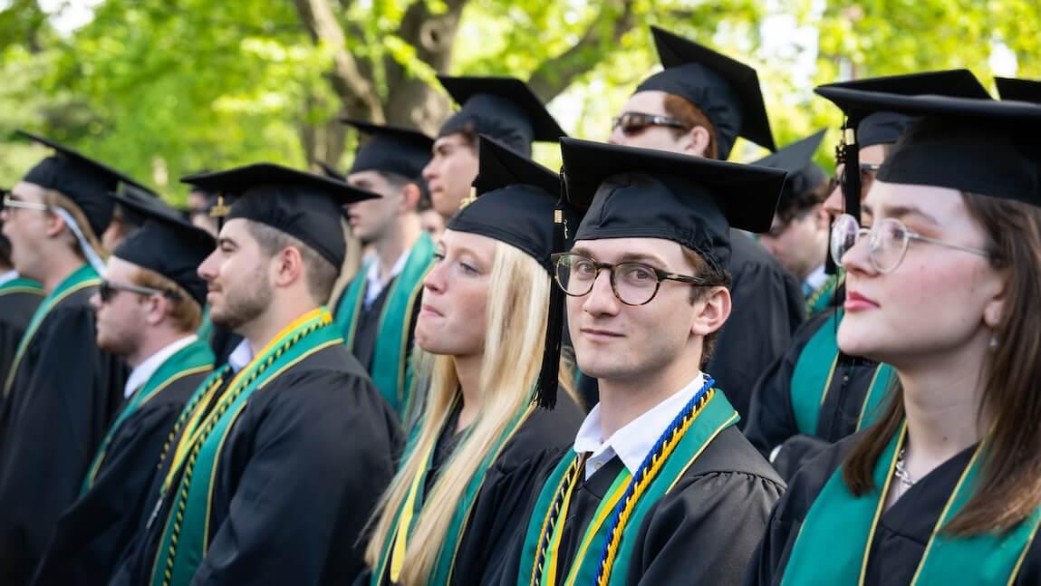 A group of graduating seniors in cap and gowns