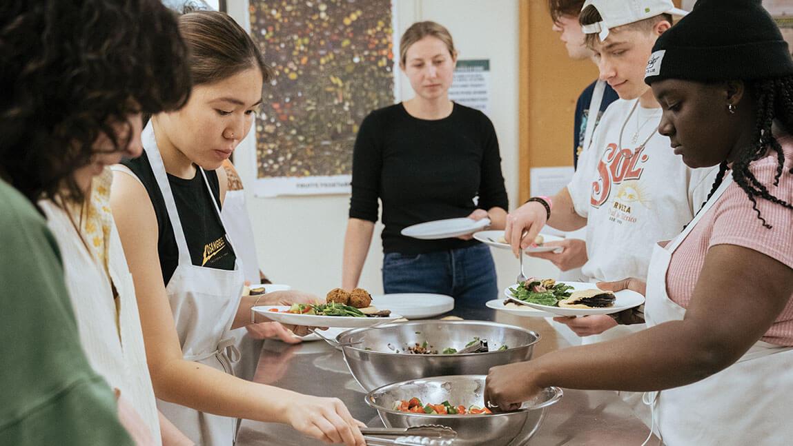 students cooking in an industrial kitchen