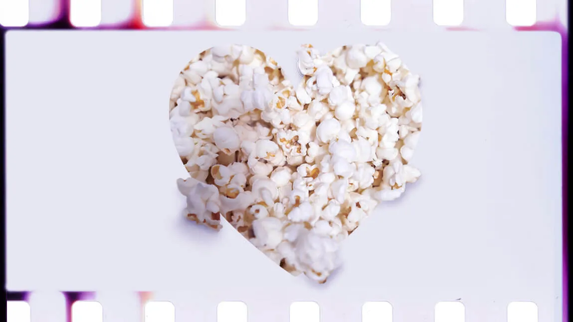 a film strip featuring a heart silhouette filled with popcorn