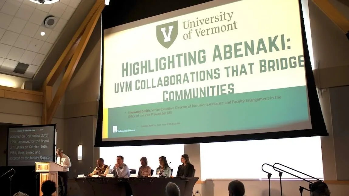 A group of people seated at a panel discussion