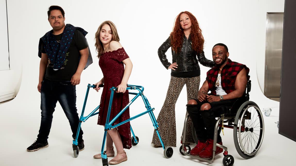 Mindy Sheier poses for a photoshoot with customers in disability-friendly clothing.