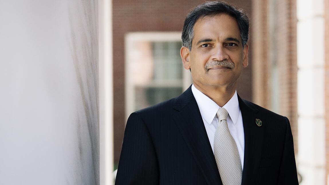 Suresh Garimella stands between two ivory columns