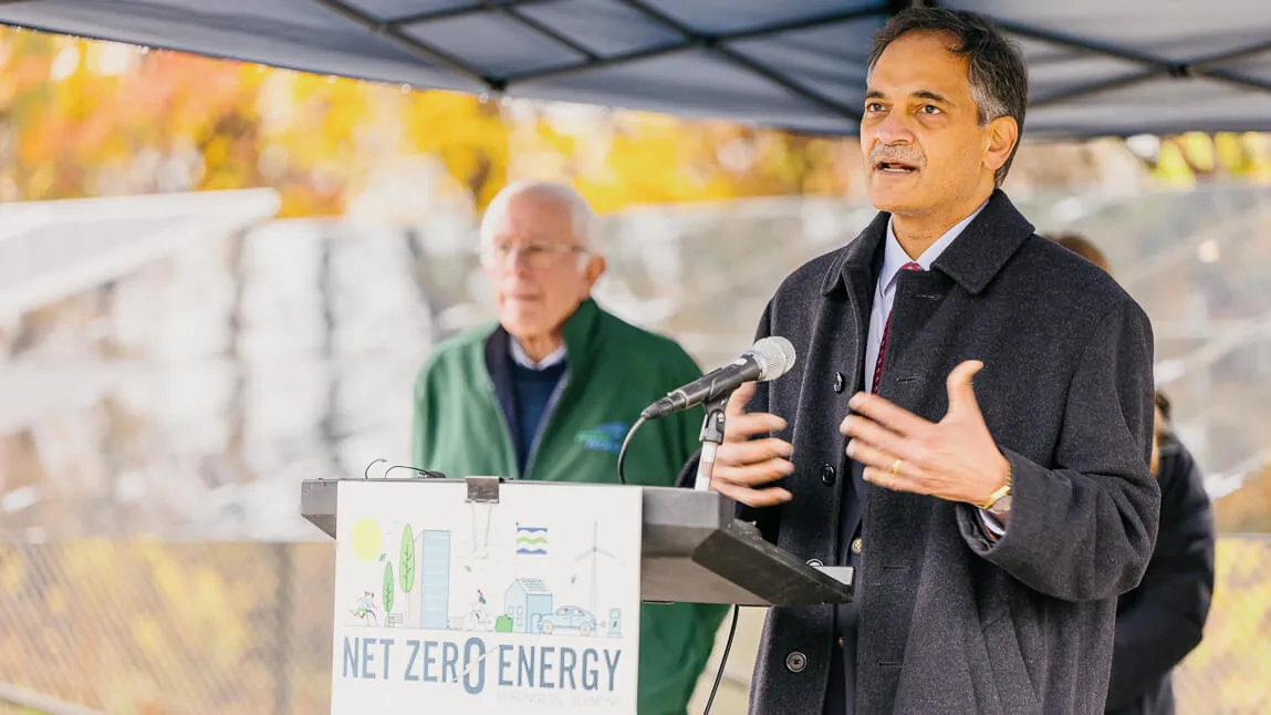 UVM President Suresh Garimella and U.S. Senator Bernie Sanders standing in fron tof UVM's Solar Research Facility