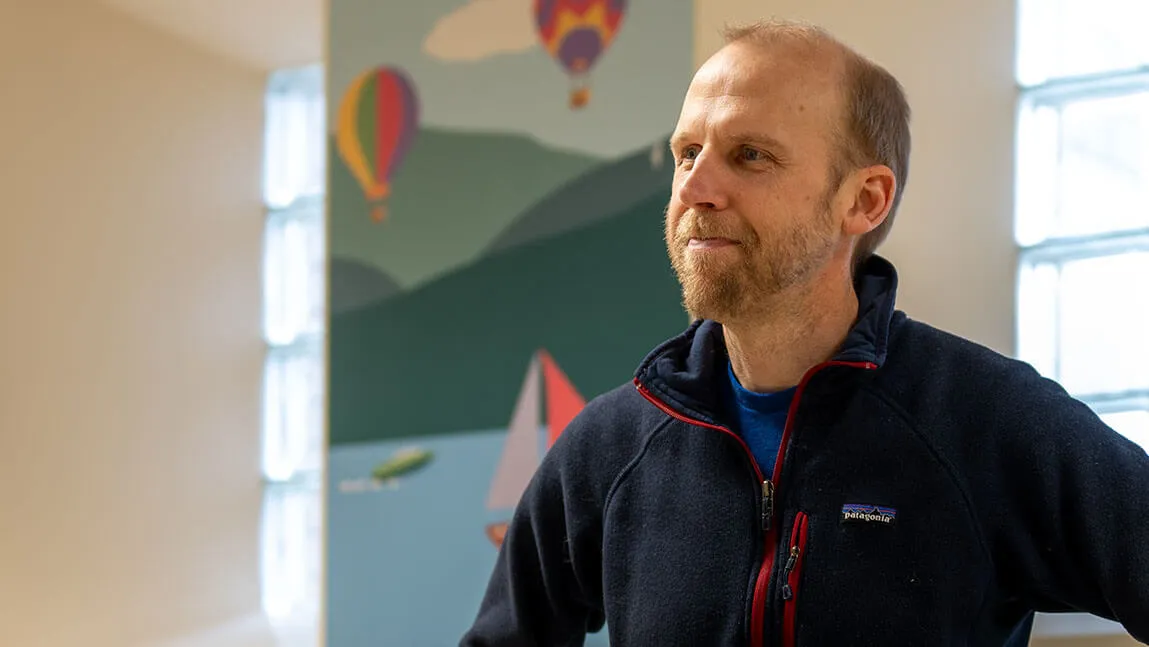 william copeland stands outside the Vermont Center for Children, Youth, and Families 