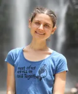 Smiling student in a blue t-shirt.