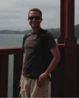 person standing on the bridge 