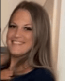 A blonde woman wearing a black shirt