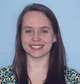 A woman with dark brown hair wearing a floral shirt