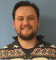 A man wearing a white and black sweater