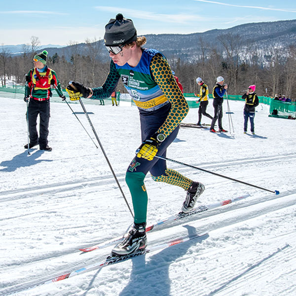 A cross country skier races by.