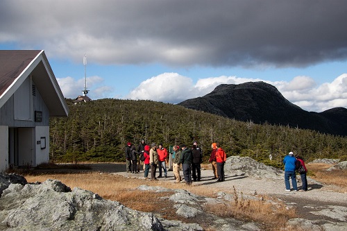 Group touring the proposed site of a Mount Mansfield Science and Stewardship Center.