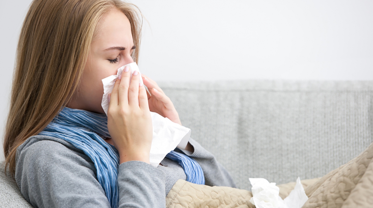 Woman sneezing