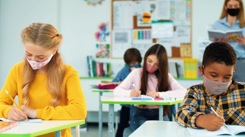 students studying in classroom during COVID-19 pandemic