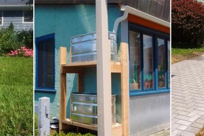 BLUE sign on lawn and driveway and rain gutters on a business