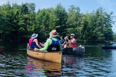 People canoeing on Lower Saint Regis Lake