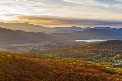 Sunrise and landscape of forests, mountains, pond