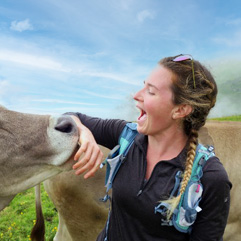 Kelsie Meehan saying hello to a friendly cow