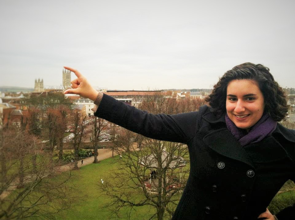 Student poses with the cathedral in the background