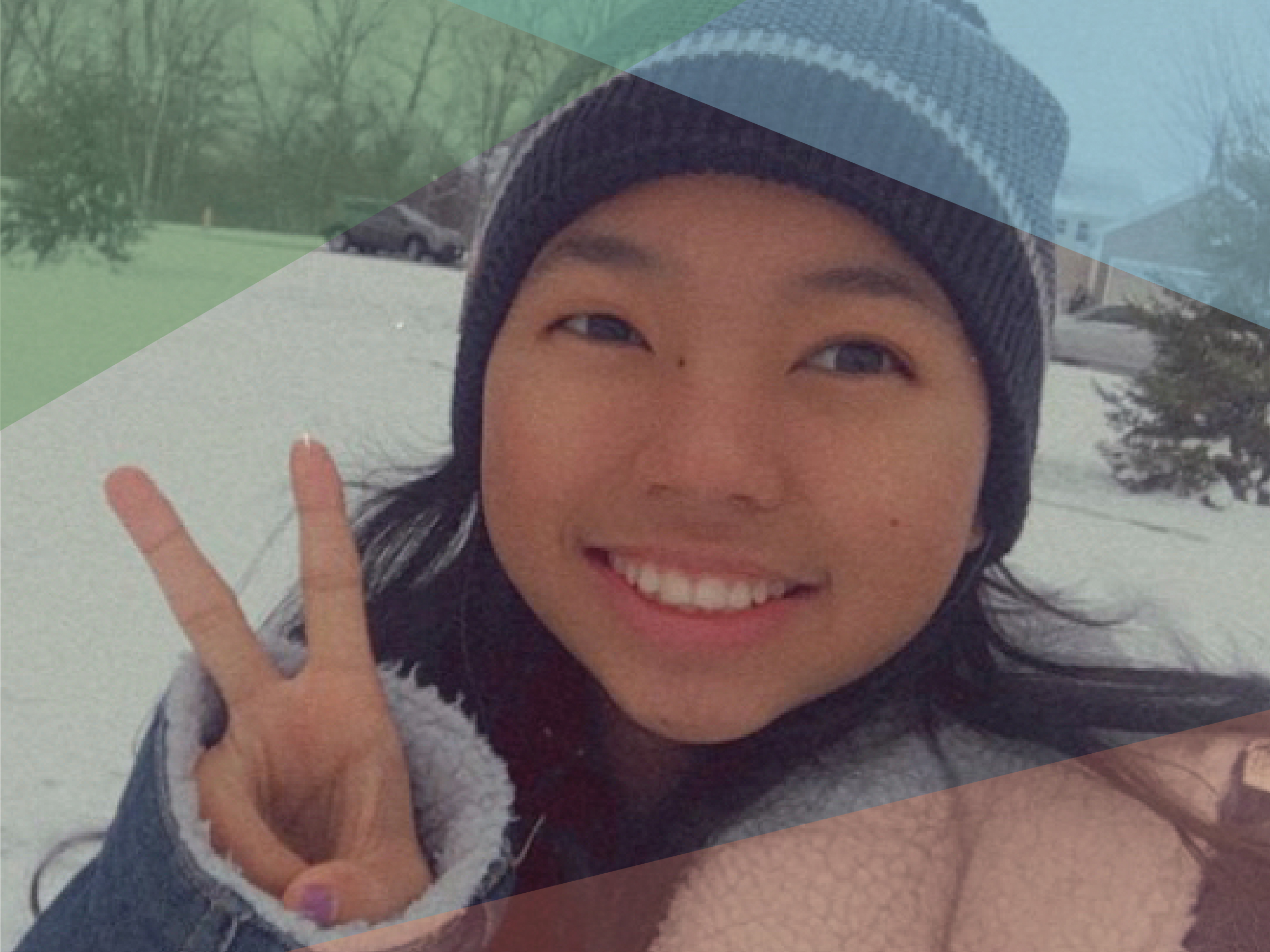 Photo of Menuka Rai smiling and holding a peace sign