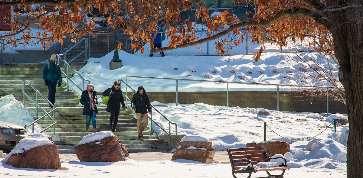 Students walking down outdoor staircase in winter