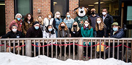 Group of supporters standing in front of rally cat's cupboard