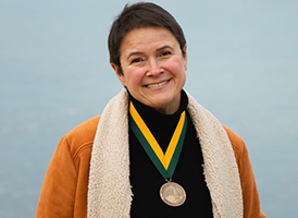 Cristina Mazzoni lakeside with investiture medal