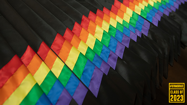 a row of rainbow stoles