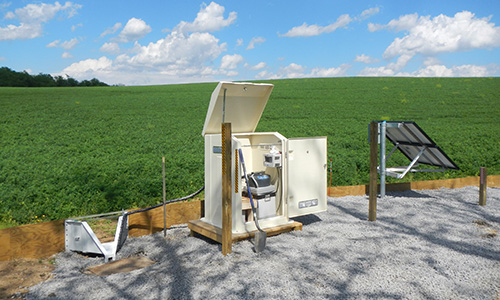 Water quality monitoring and testing equipment on the edge of a farm field