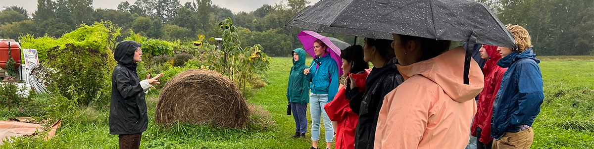UVM students visit a local farm to learn about refugee agriculture as part of their study of immigrants, diasporas, and the meaning of food and foodways