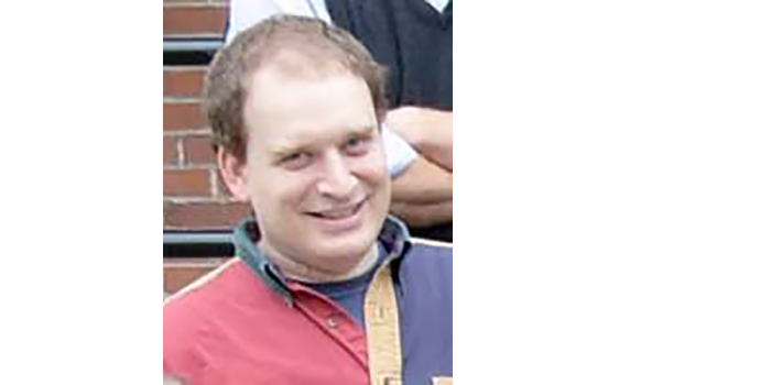 Matt Weiner smiling for the camera in and outdoor setting