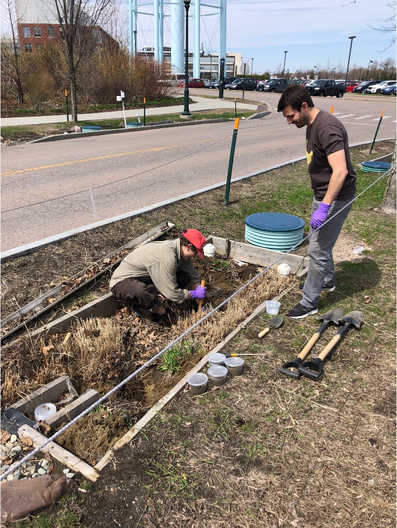 Students preparing retention pits for spring run off