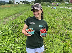 young person in a berry field