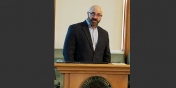 Chris Vaccaro at a lectern 