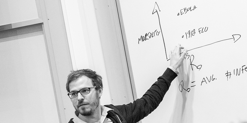 Hébert-Dufresne standing at the white board