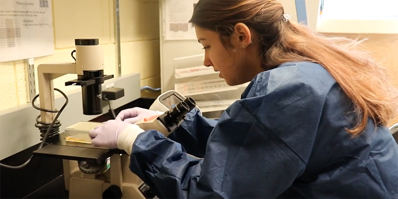 Walters with a microscope in the lab