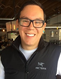 Headshot of Stephen Montaño, who is wearing glasses and smiling