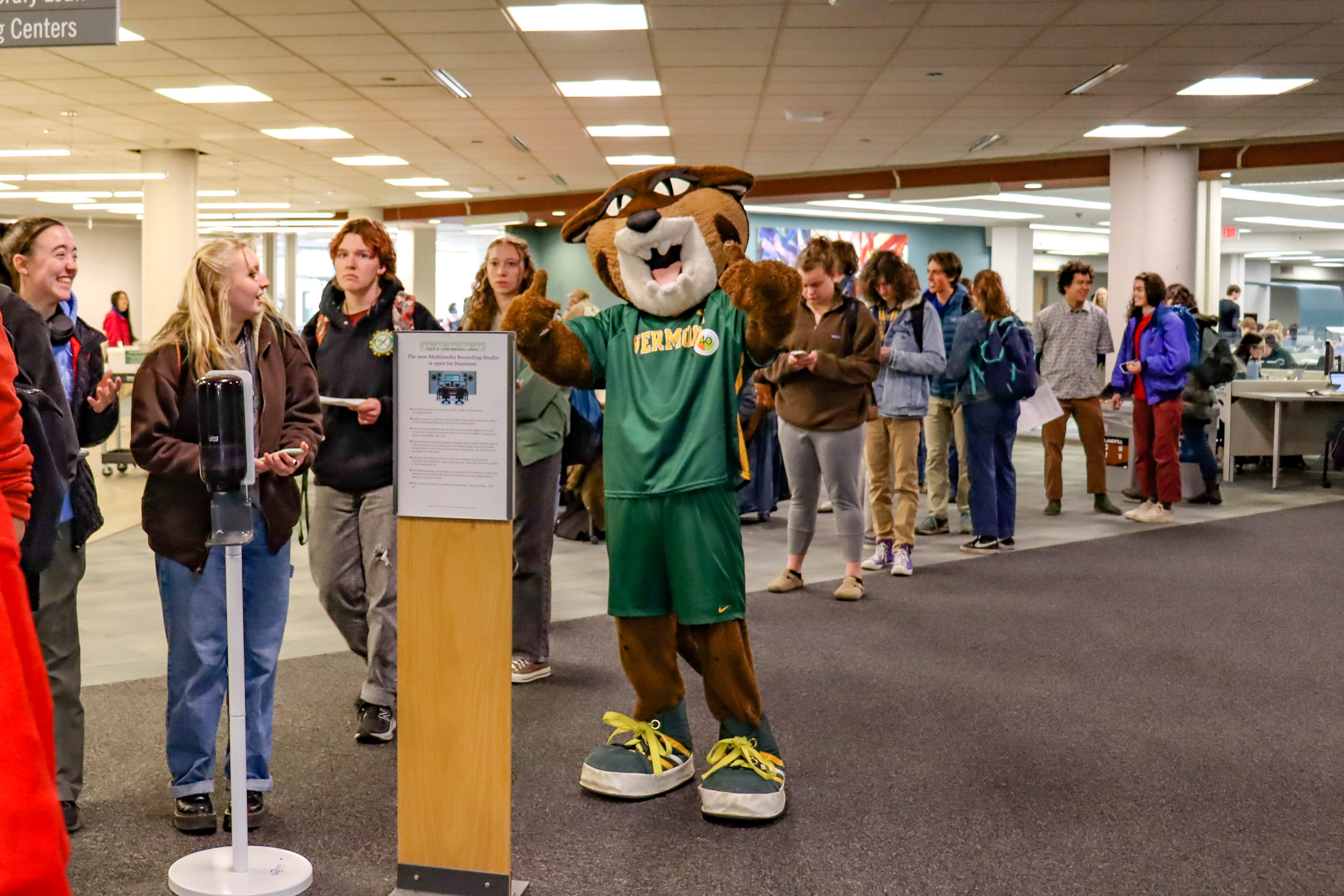 Rally Cat greeted students who waited in line for their piece of cake.