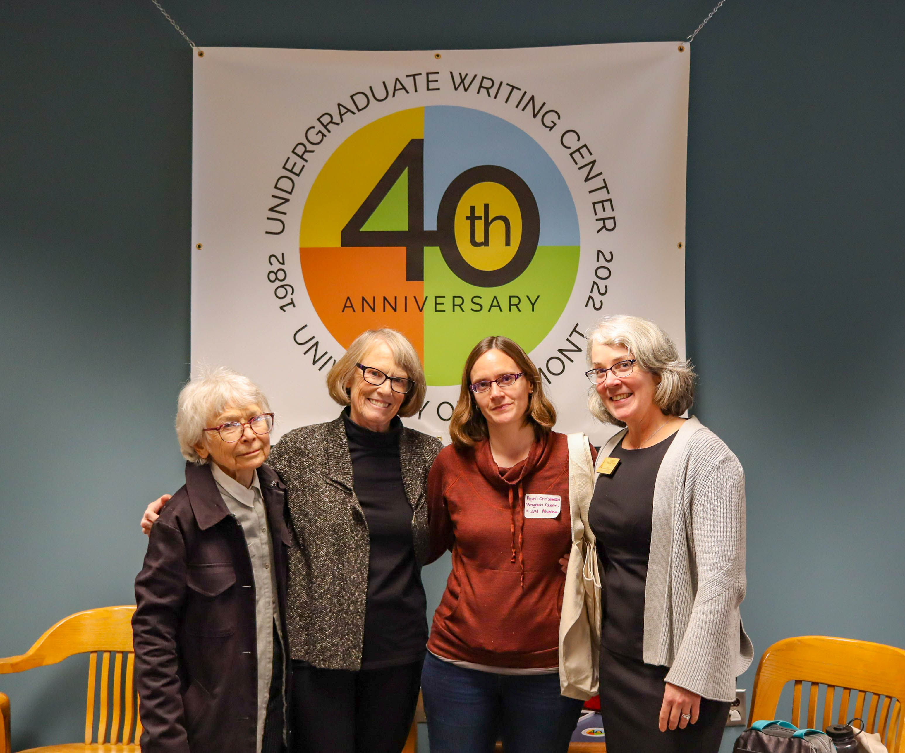 Retired directors Jean Keidaisch and Sue Dinitz posed with Program Coordinator April Christenson and current Director Sheila Boland Chira under the 40th logo.
